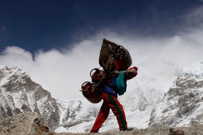 Sherpa ascending the Khumbu Ice Fall on the South Col Route for Mount Everest